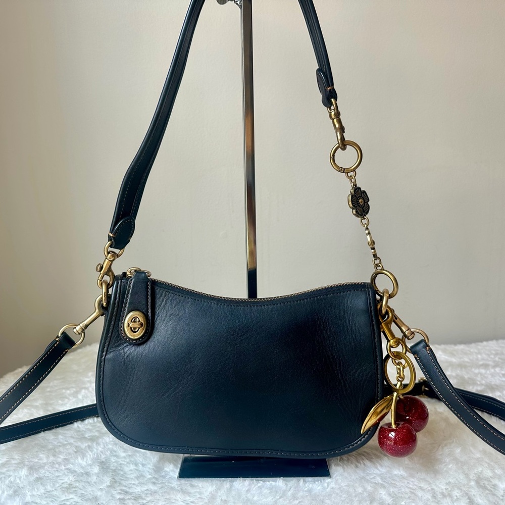 Coach Swinger Bag 20 in black with cherry charm